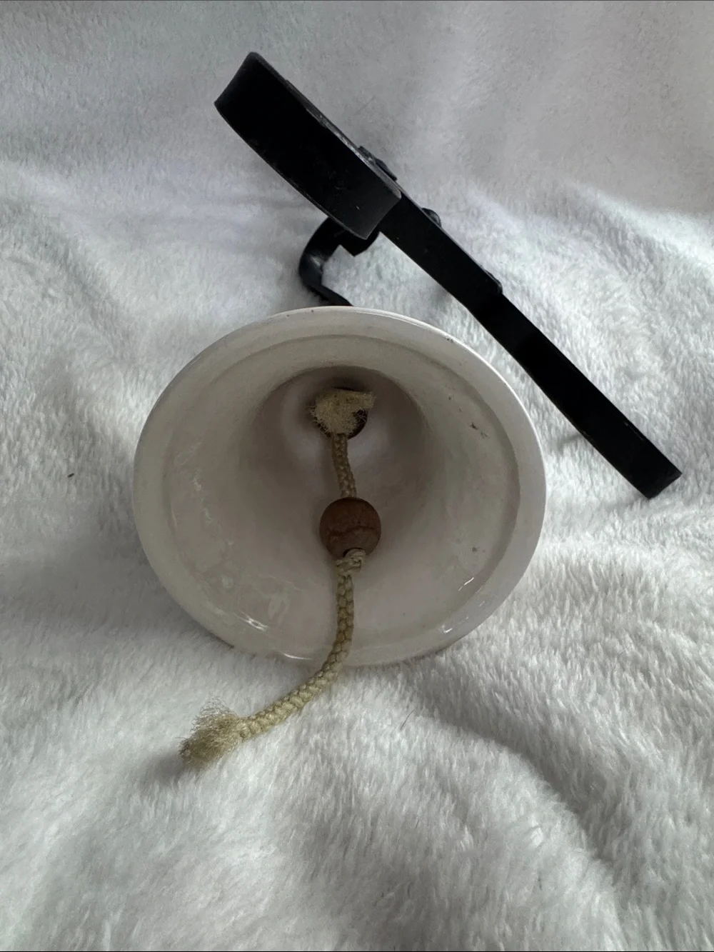 White Ceramic Bell Wall Decor with Black Iron Bracket